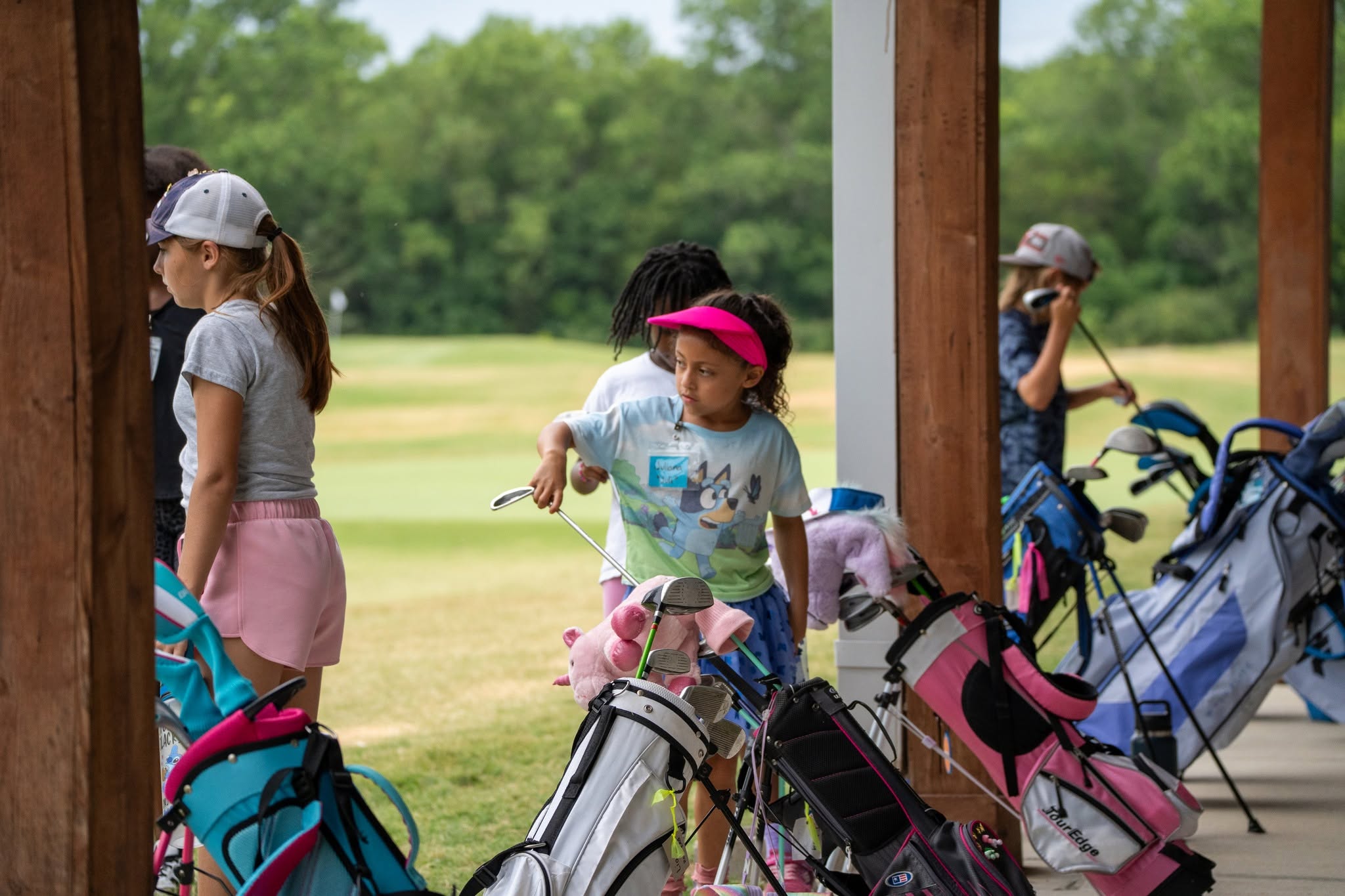 A young golfer celebrating after a swing